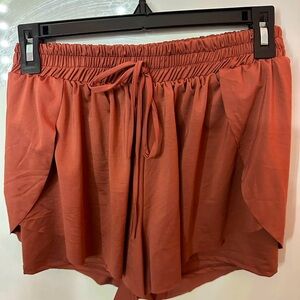 maroon/pinkish shorts